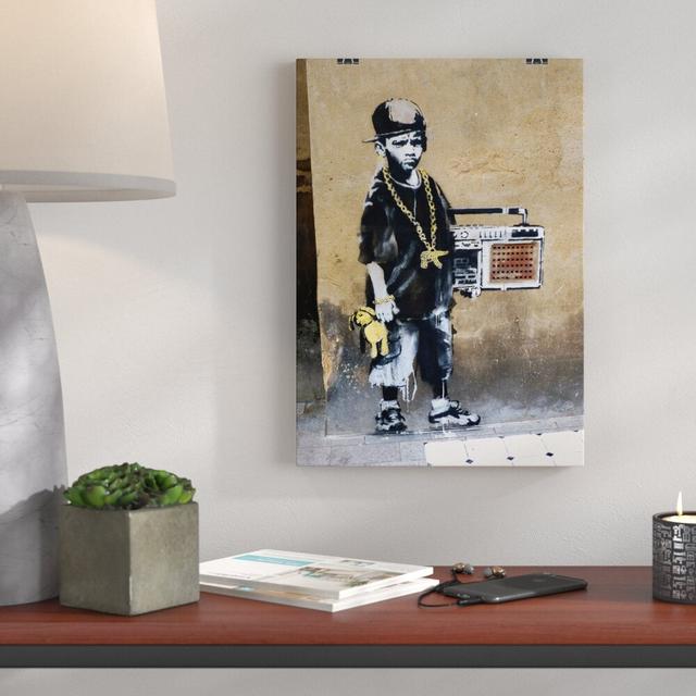 Kid with Ghetto Blaster Graffiti by Banksy Graphic Art Big Box Art Size: 42cm H x 29.7cm W on Productcaster.