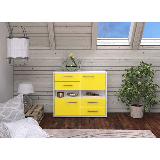 The Bargeron sideboard. It is free -standing and features metal handles Brayden Studio Colour: Yellow/White on Productcaster.