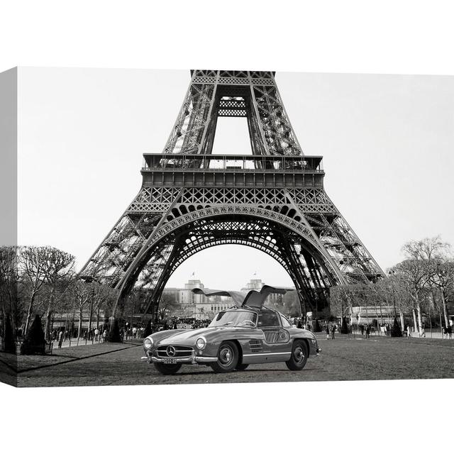 Leinwandbild Roadster Under the Eiffel Tower (BW) von Gasoline Images Rosalind Wheeler Größe: 70 cm H x 100 cm B x 4 cm T on Productcaster.