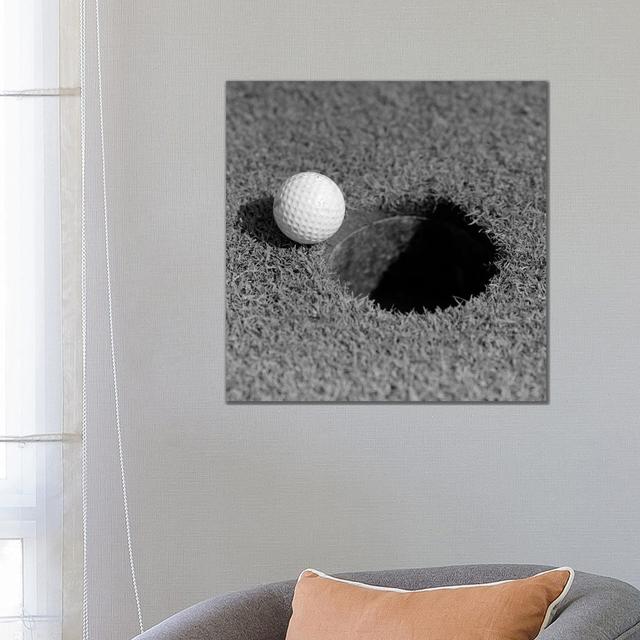 1950s Close-up Of Golf Ball On Green On Very Edge Of Cup by Vintage Images - Wrapped Canvas Print Ebern Designs Size: 26cm H x 26cm W on Productcaster.