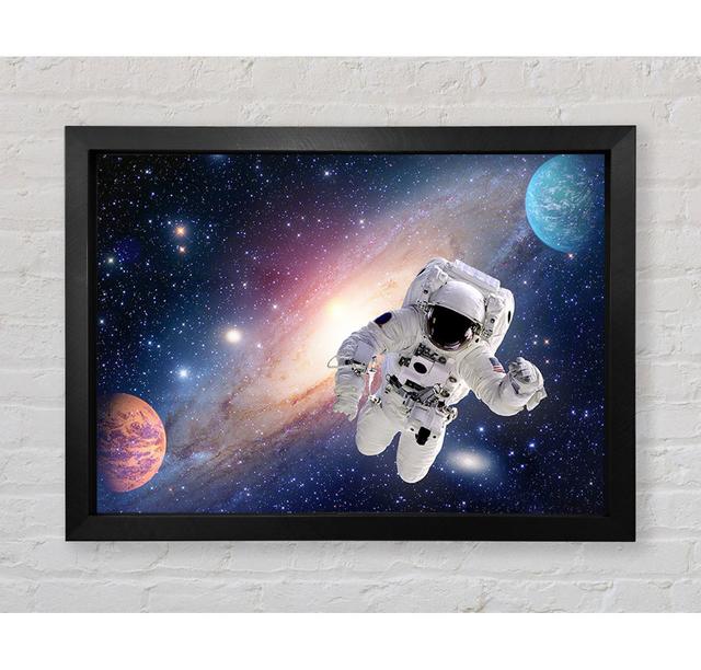 Spaceman In The Galaxy Framed Print Brayden Studio Format: Black Framed Paper, Size: 100cm H x 141.4cm W x 3.4cm D on Productcaster.