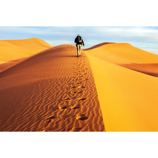 Male Tourists Walking On The Sand Dunes, Morning, Mhamid, Morocco by Pavliha - No Frame Print on Canvas Natur Pur Size: 61cm H x 91cm W on Productcaster.