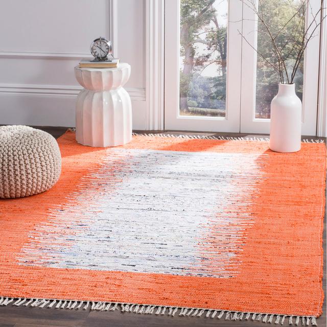 Handgefertigter Teppich Dumont aus Baumwolle in Elfenbeinfarben/Orange Haus am Meer Teppichgröße: Rechteckig 152 cm x 243 cm on Productcaster.