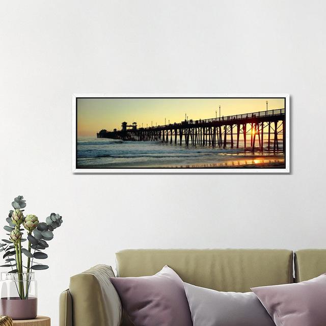 Pier in the ocean at sunsetOceanside, San Diego County, California, USA Highland Dunes Size: 40.64cm H x 121.92cm W, Frame Colour: White on Productcaster.