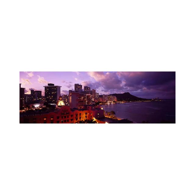 Buildings Lit Up At Dusk, Waikiki, Oahu, Hawaii, USA - Wrapped Canvas Panoramic Print Ebern Designs Size: 30.48cm H x 91.44cm W x 3.81cm D on Productcaster.