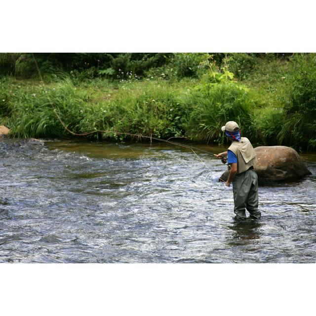 Man In Shallow River Fly Fishing by Oksanaphoto - Wrapped Canvas Print Ebern Designs Size: 81.28cm x 121.92cm on Productcaster.