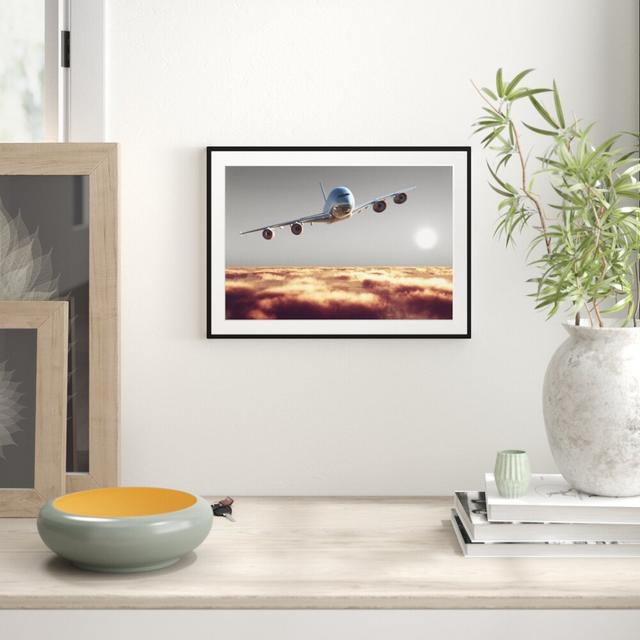 Gerahmter Fotodruck Aeroplane Above Clouds East Urban Home Größe: 70 cm H x 100 cm B x 2,5 cm T, Farbe: Rot on Productcaster.