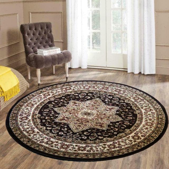 Coderre Floral Machine Woven Brown Area Rug ClassicLiving Rug Size: Round 120cm on Productcaster.