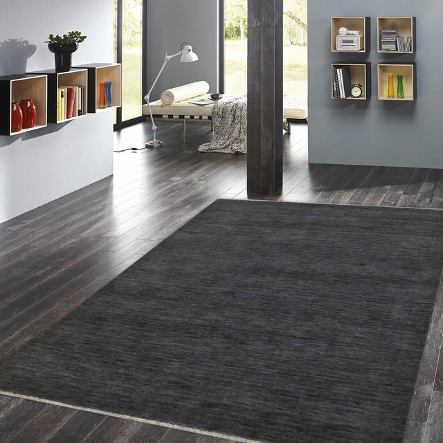 Brycen Solid Colour Hand Woven Black Area Rug August Grove Rug Size: Rectangle 140 x 200cm on Productcaster.