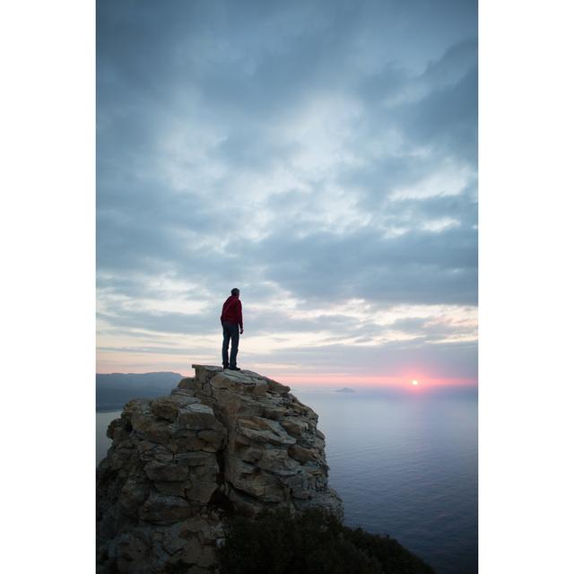 Man Looks At The Seascape From A Cliff by Deimagine - No Frame Print on Canvas 17 Stories Size: 76cm H x 51cm W on Productcaster.