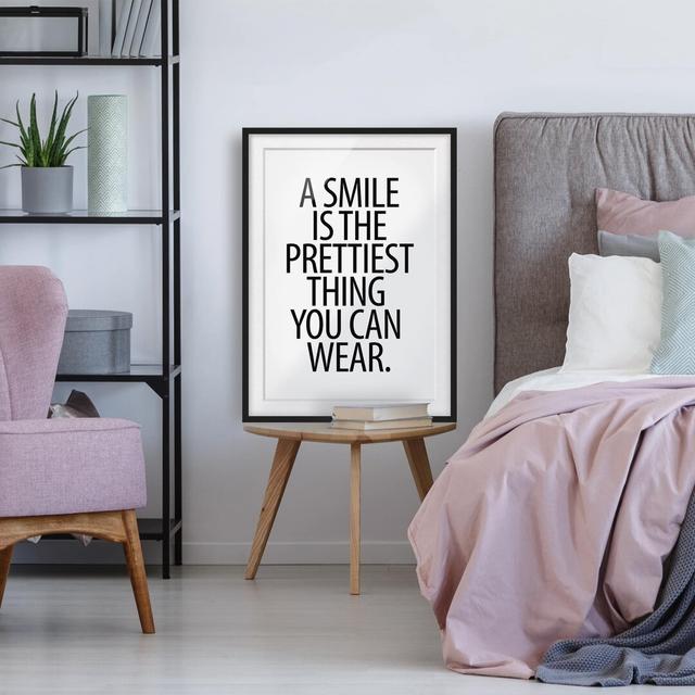 Gerahmtes Poster A Smile is the Prettiest Thing Sans Serif East Urban Home Größe: 40 cm H x 30 cm B, Rahmenauswahl: Mattes Schwarz on Productcaster.