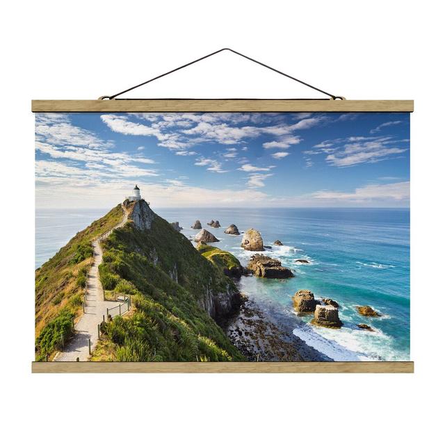 Nugget Point Lighthouse and Sea New Zealand - Graphic Art Print Highland Dunes Size: 53.5cm H x 80cm W x 0.3cm D on Productcaster.