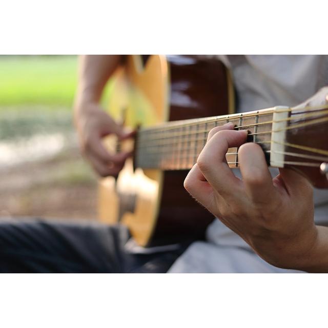 Guitarist Playing Guitar - Wrapped Canvas Photograph Ebern Designs Size: 61cm H x 91cm W x 3.8cm D on Productcaster.