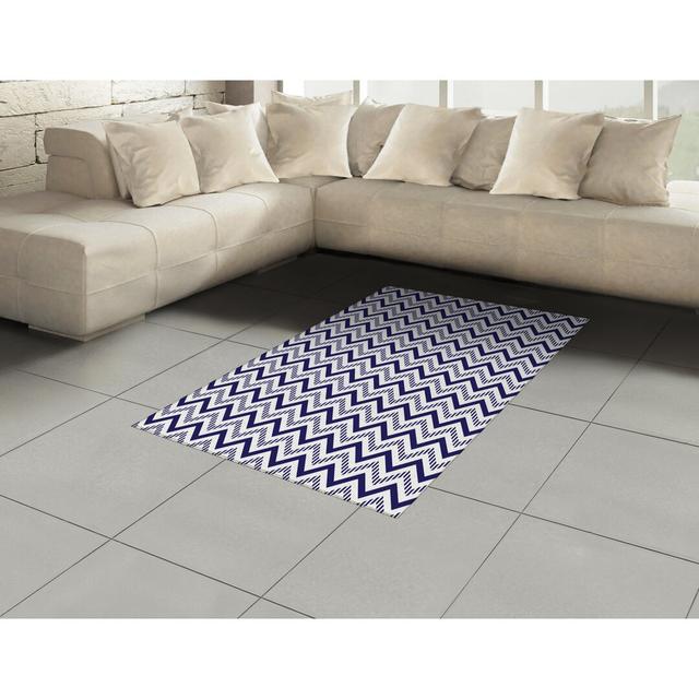 Flatweave Rug in Navy Blue with Chevron Pattern by Ebern Designs on Productcaster.