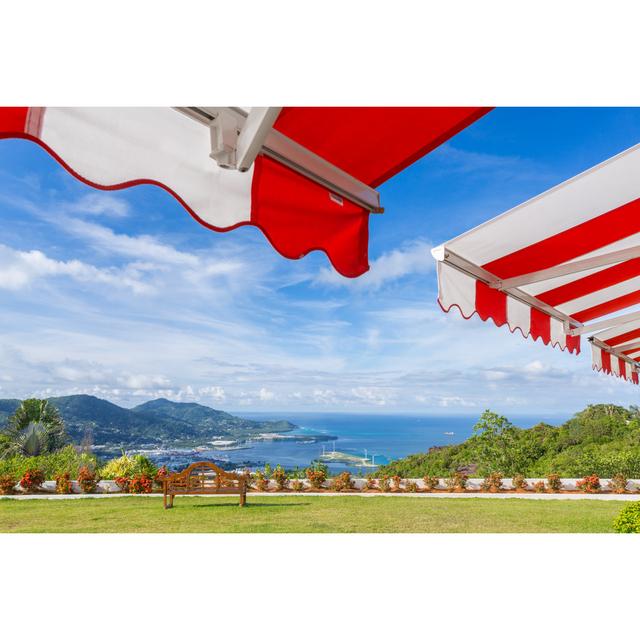 Awning Over Bright Sunny Blue Sky With The View by ElenaSeychelles - Wrapped Canvas Print Longshore Tides Size: 81cm H x 122cm W on Productcaster.