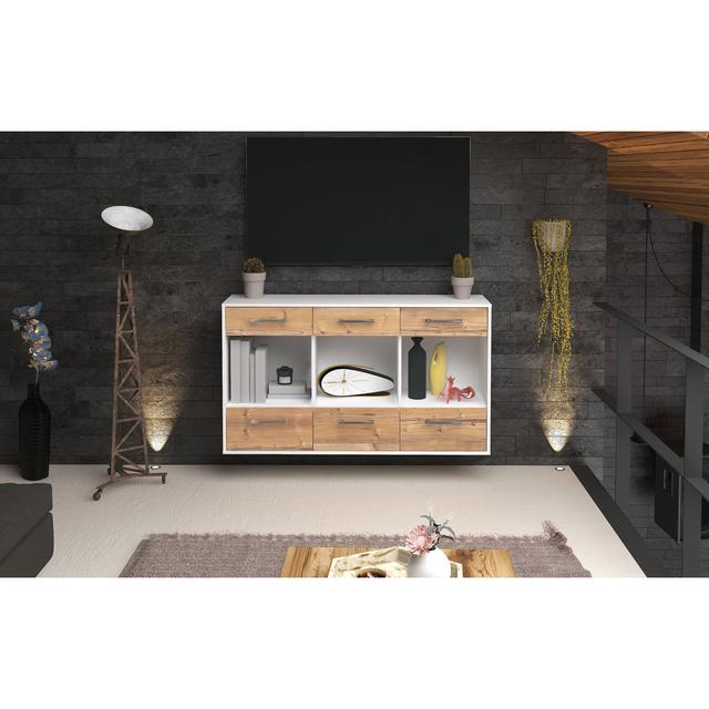 Das Sideboard Myella ist aus weißer Eiche gefertigt. Es hat einen fliegenden Metallgriff und misst 136 cm x 79 cm x 35 cm. Ebern Designs Farbe: Pinie/ on Productcaster.