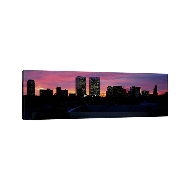 Silhouette of Buildings in a City - Wrapped Canvas Panoramic Photograph Ebern Designs Size: 16cm H x 48cm W x 2cm D on Productcaster.