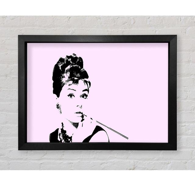 Audrey Hepburn Zigaretten-Pose Rosa - Druck Canora Grey Format: Poster mit schwarzem Rahmen, Größe: 42cm H x 59,7cm B x 3,4cm T on Productcaster.