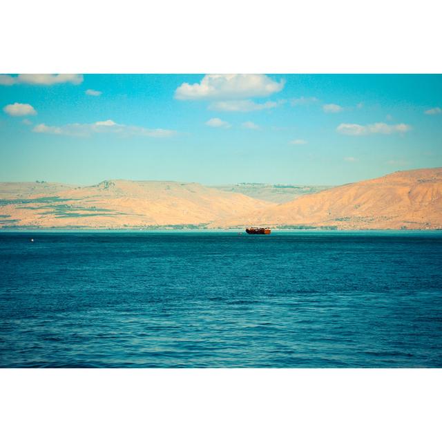 Brown Wooden Boat Sailing in Sea of Galilee by Maor Winetrob - Wrapped Canvas Photograph Longshore Tides Size: 30.48cm H x 45.72cm W on Productcaster.