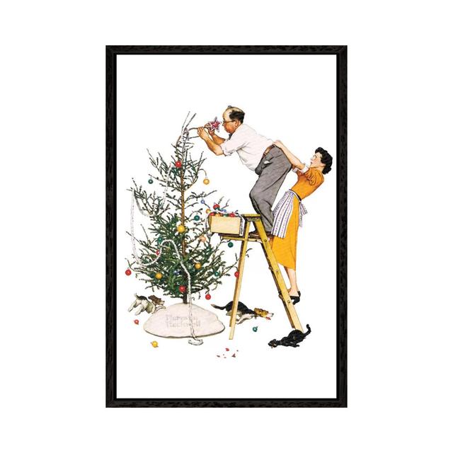 Leinwandbild Trimming the Tree von Norman Rockwell Die Saisontruhe Größe: 101,6 cm H x 66,04 cm B x 3,8 cm T, Format: Schwarzer Rahmen on Productcaster.