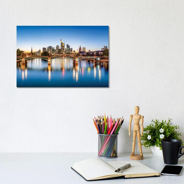 Frankfurt Central Business District And Ignatz-Bubis-Brücke (Ignatz Bubis Bridge) At Night, Hesse, Germany by Jan Becke - Wrapped Canvas Panoramic Pri on Productcaster.