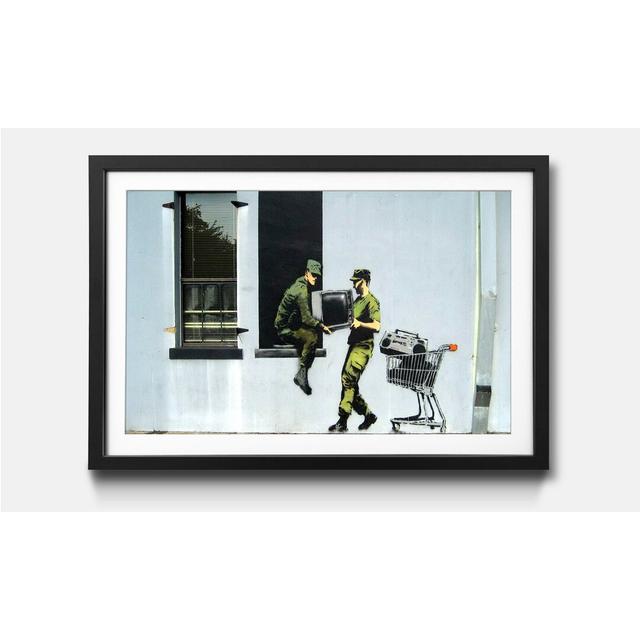 'The Tv Loving Army' by Banksy - Picture Frame Graphic Art Print on Paper Ebern Designs Size: 44cm H x 64cm W x 2.2cm D on Productcaster.