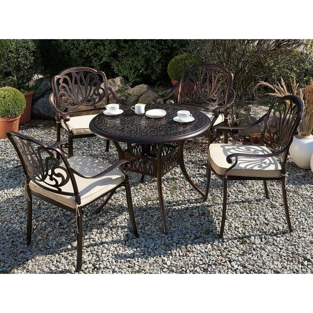 Aadhiran 4 Seater Dining Set with Cushions Sol 27 Outdoor on Productcaster.