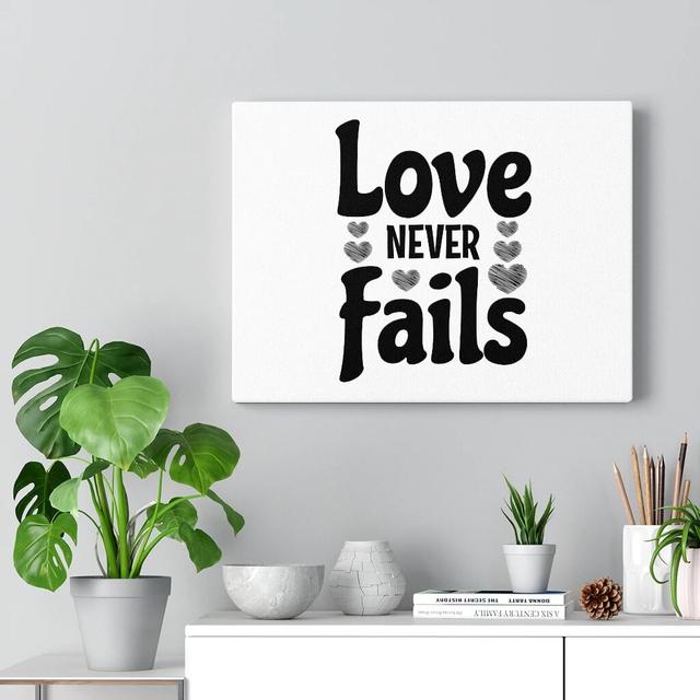 Love Never Fails - Wrapped Canvas Typography Blue Elephant Size: 30cm H x 41cm W on Productcaster.