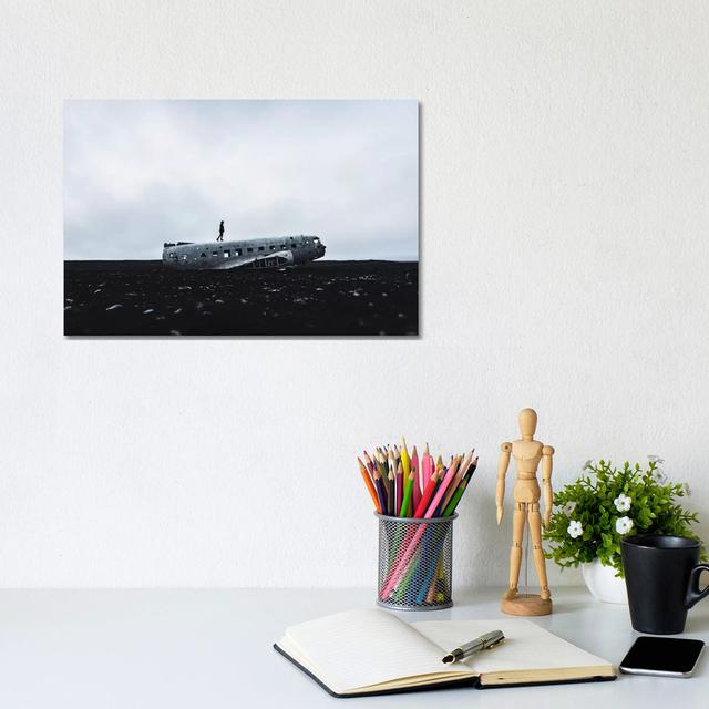 Man Walking Plane Wreck by James Vodicka - Wrapped Canvas Gallery-Wrapped Canvas Giclée Latitude Run Size: 20.32cm H x 30.48cm W x 1.91cm D on Productcaster.