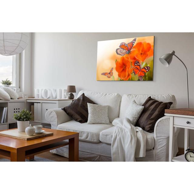 Leinwandbild Orangene Blumen mit Schmetterlingen East Urban Home Größe: 120 L x 80 B on Productcaster.