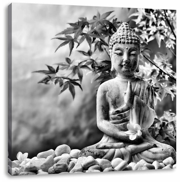 Leinwandbild Buddha auf Steinen mit Monoi Blüte in der Hand East Urban Home Größe: 40 cm H x 40 cm B on Productcaster.