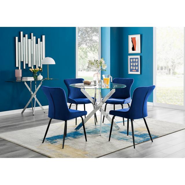 Novara Round Glass Dining Table & 4 Blue Nora Black Leg Chairs Furniture Box on Productcaster.