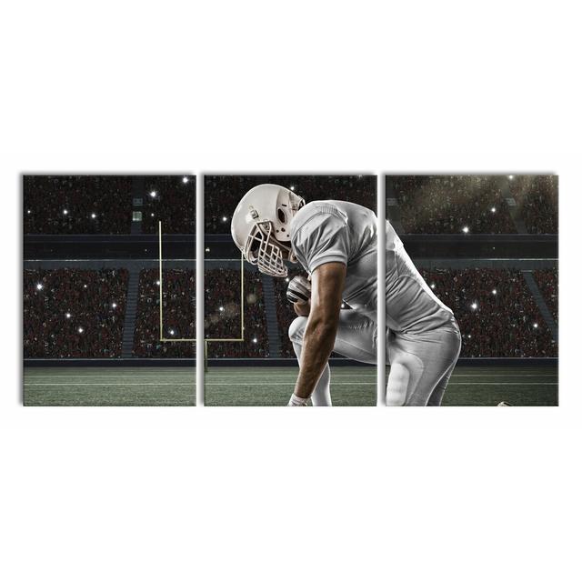 Kneeling Football Player - 3 Piece Wrapped Canvas Print East Urban Home Size: 80cm H x 180cm W on Productcaster.