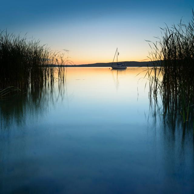 Sailboat on calm lake at sunrise House of Hampton Size: 20cm H x 20cm W on Productcaster.