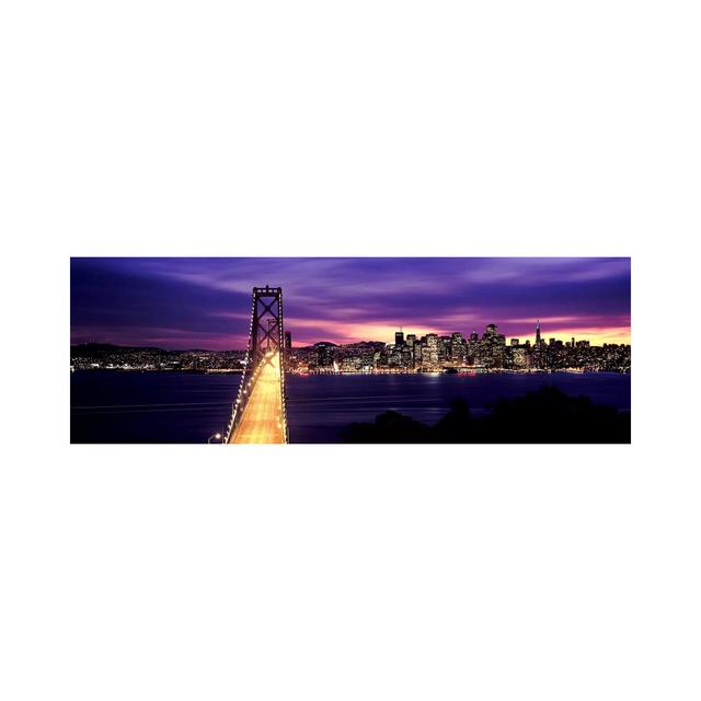 Bridge Lit Up At Dusk, Bay Bridge, San Francisco Bay - Wrapped Canvas Panoramic Print Ebern Designs Size: 50.8cm H x 152.4cm W x 1.91cm D on Productcaster.