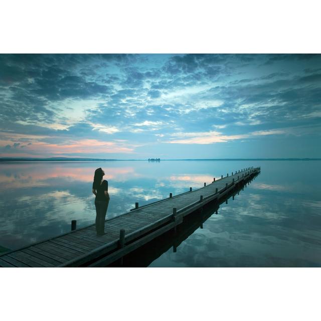 Silhouette Of Young Woman Standing On Lakeside Jetty At Dusk by RelaxFoto.de - No Frame Art Prints on Canvas Beachcrest Home Size: 20cm H x 30cm W on Productcaster.