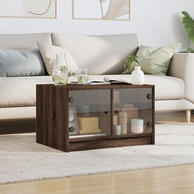 Coffee Table with Glass Doors 68 x 50 x 42 in. 17 Stories Colour: Brown Oak on Productcaster.