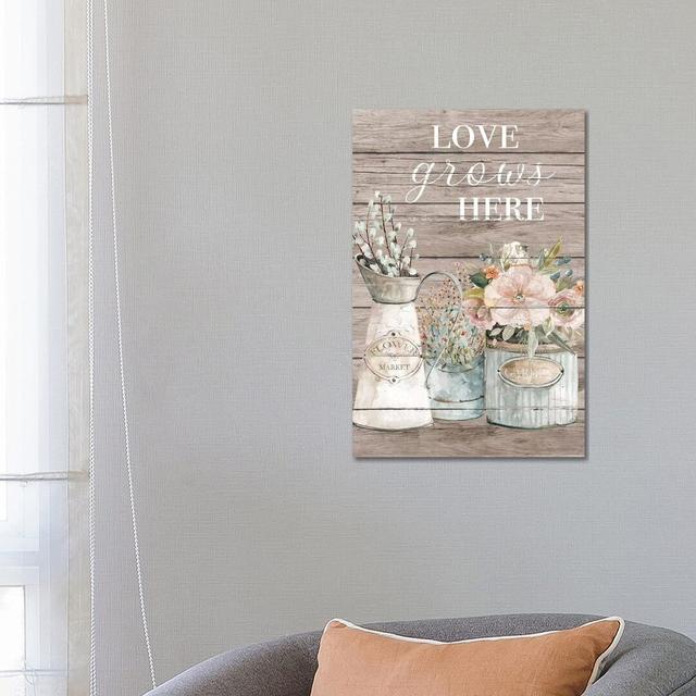 Love Grows Here Fleur De Lis Living Size: 66.04cm H x 45.72cm W x 1.91cm D, Format: Wrapped Canvas on Productcaster.