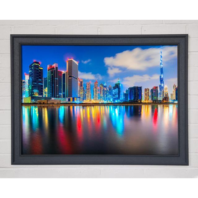 Bunte Stadt bei Nacht - Druck ModernMoments Größe: 84,1 cm H x 118,9 cm B x 1,5 cm T, Format: Poster mit metallgrauem Rahmen on Productcaster.