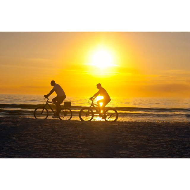 Couple biking at sunset House of Hampton Size: 61cm H x 91cm W on Productcaster.