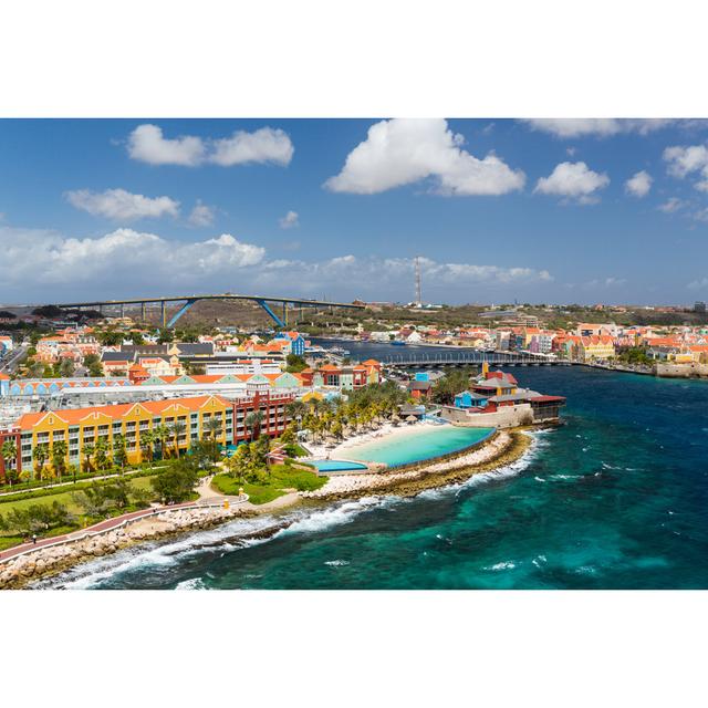 Willemstad in Curacao and the Queen Emma Bridge by Chrisuk1 - Wrapped Canvas Photograph 17 Stories Size: 61cm H x 91cm W on Productcaster.