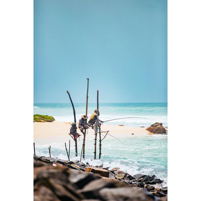 Stilt Fishermen Of Sri Lanka by Andrey Danilovich - No Frame Art Prints on Canvas Beachcrest Home Size: 76cm H x 51cm W on Productcaster.