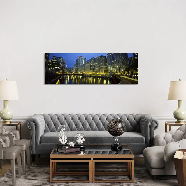 Low angle view of buildings Lit up at Night, Chicago River, Chicago, Illinois, USA - Wrapped Canvas Panoramic Photograph Ebern Designs Size: 50.8cm H on Productcaster.