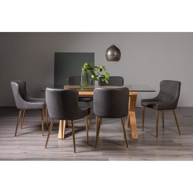 Light Oak Rectangular Glass Dining Table-&-6-Upholstered Arm Chair Quilted With Diamond Stitched Pattern & Matt Gold Plated Frame Dark Grey Faux Leath on Productcaster.