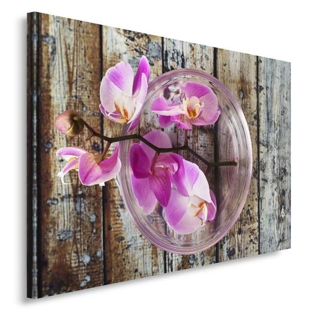 Leinwandbild Orchidee auf einem Hintergrund aus Holz ModernMoments Größe: 40 cm H x 50 cm B on Productcaster.