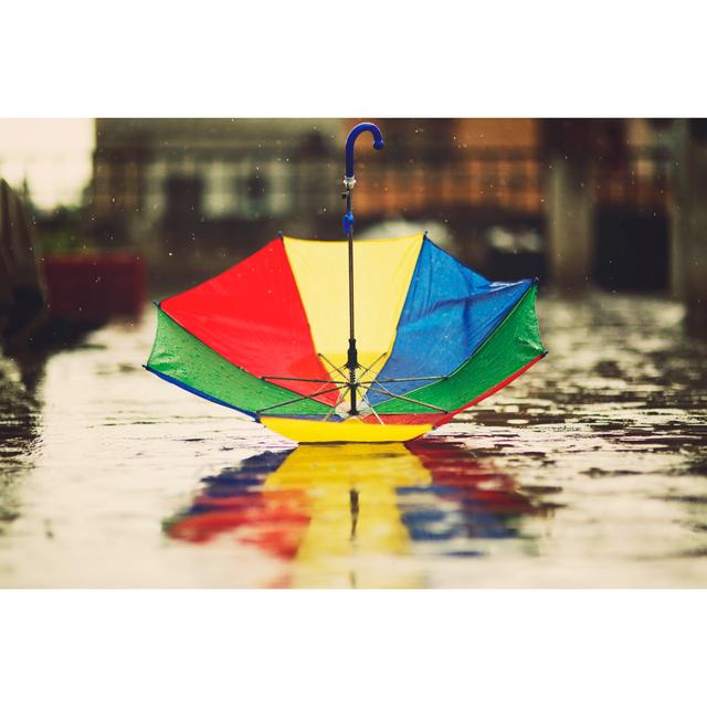 Multi-Coloured Upside Down Umbrella In Rain by Triloks - Print 17 Stories Size: 30cm H x 46cm W on Productcaster.