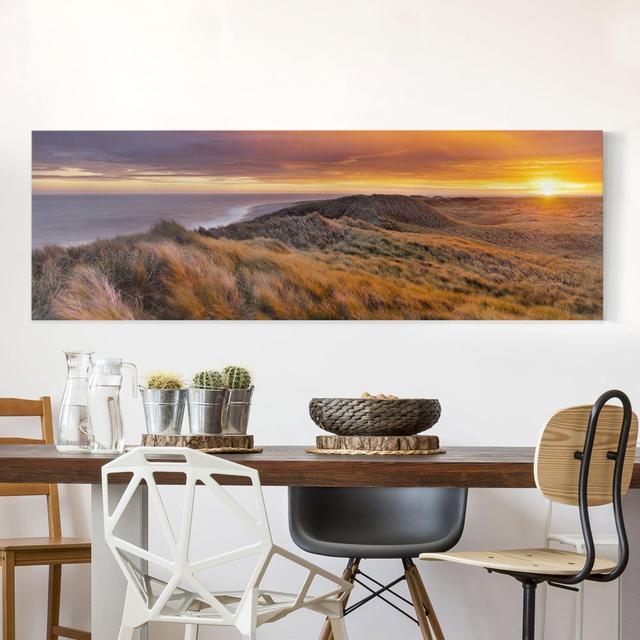 Leinwandbild - Sonnenaufgang Am Strand Auf Sylt - Panorama Quer Haus am Meer Größe: 40 cm H x 120 cm B, Format: 260g/m² Canvas, Farbe: Orange on Productcaster.