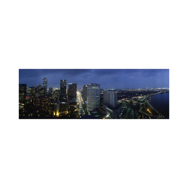 High Angle View Of Buildings In A City Lit Up At Night - Wrapped Canvas Panoramic Print Ebern Designs Size: 50.8cm H x 152.4cm W x 1.905cm D on Productcaster.