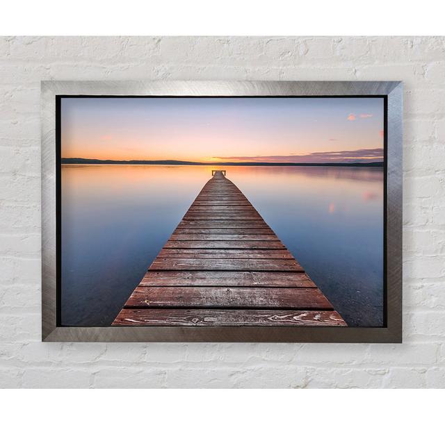 Tranquil Dock To The Sun Framed Print House of Hampton Size: 84.1cm H x 118.9cm W x 3.4cm D, Format: Silver Framed Paper on Productcaster.