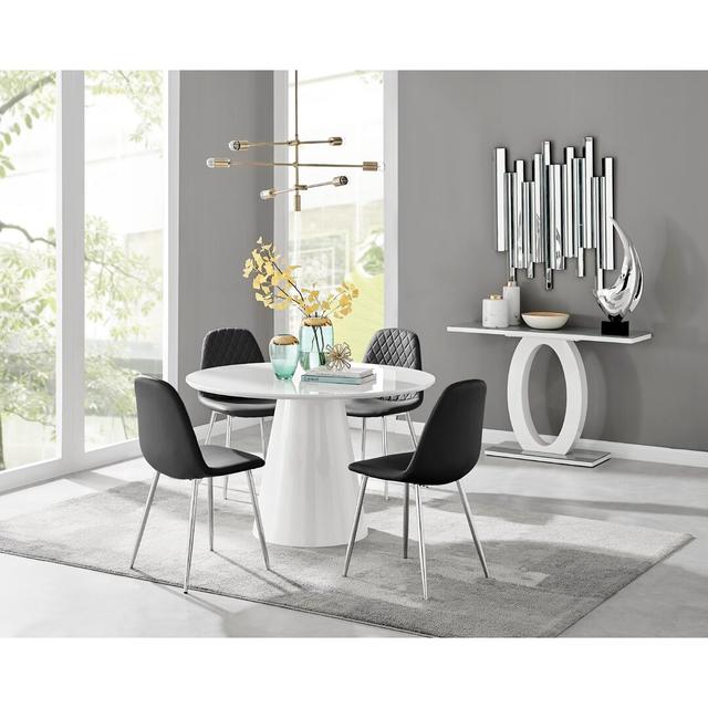 Edzard Statement Pedestal Round Dining Table Set & 4 Luxury Faux Leather Dining Chairs Canora Grey Colour (Chair): Black/Silver, Table Colour: White on Productcaster.